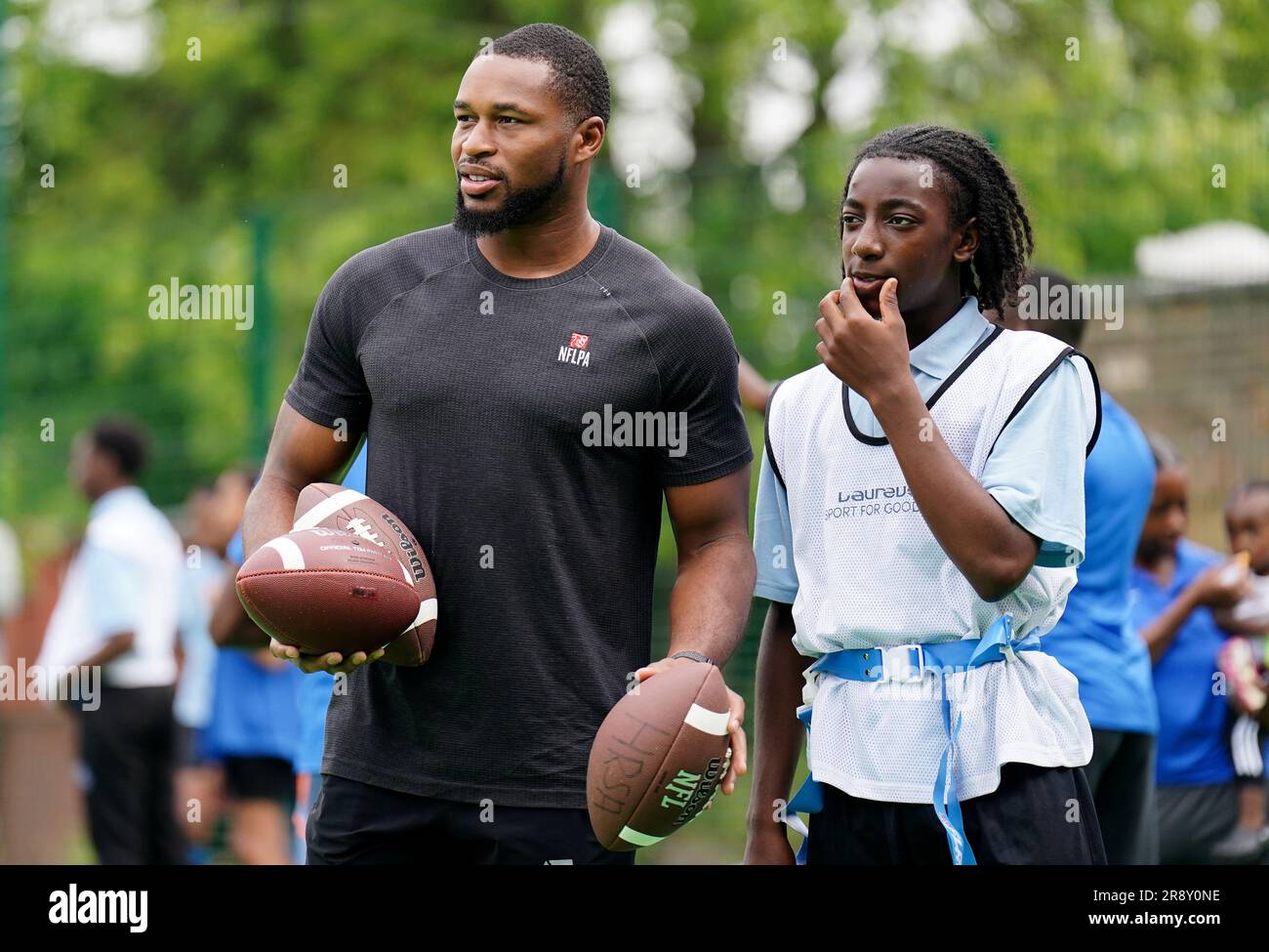 Kevin Byard from the NFL team Tennessee Titans coaches students during a visit to Gladesmore Community School, London. Stock Photo