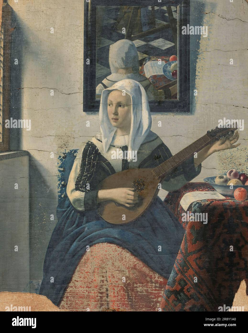 Woman playing a cittern, 1930-1940. Seated woman reflected in the mirror on the wall behind her. Painted in the style of Johannes Vermeer. Henricus Antonius van Meegeren was a Dutch painter and portraitist, considered one of the most ingenious art forgers of the 20th century. He became a national hero after World War II when it was revealed that he had sold a forged painting to Reichsmarschall Hermann G&#xf6;ring during the Nazi occupation of the Netherlands. Stock Photo