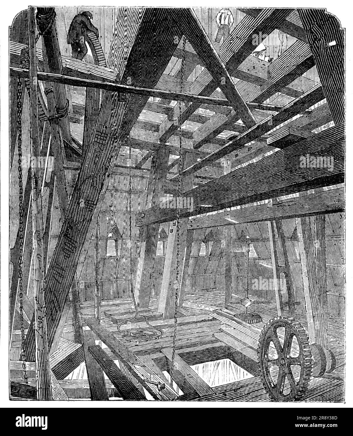 Scaffolding for Raising the Quarter-Bells in the Clock Tower of the New Houses of Parliament, [London], 1857. St Stephen's Tower, (later renamed the Elizabeth Tower), was designed to hold 'Big Ben', the Great Bell of the Great Clock of Westminster. View showing '...the pile of timbers which is now being put up within the limits of the roof of the Clock Tower, for the purpose of raising the bells. It rises nearly twenty feet above the bell chamber, resting mostly upon the iron framework which will eventually carry the bells. It is substantially put together. Upon the upper portion of this rests Stock Photo