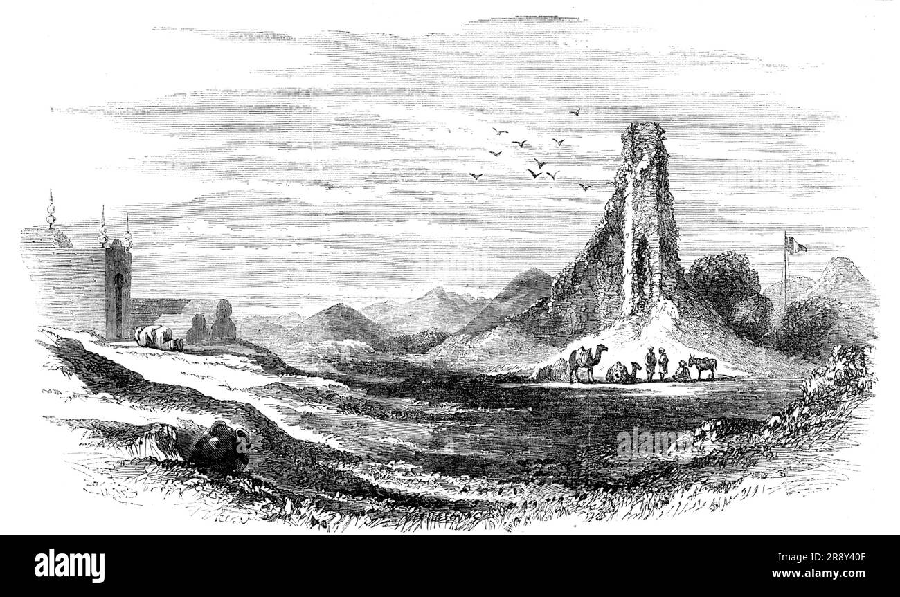 Ruins of Brahmunabad, in Sind, 1857. Ruined city in what is now Pakistan. 'The most prominent object is the remains of a high tower of brickwork standing isolated on a large heap of ruins. This may have been the citadel, or one of those circular towers such as are seen in Sind to this day in the forts of Hyderabad and Omercote. The present appearance of the city is a vast mass of ruins, forming irregular mounds or hillocks...with here and there open spaces or squares, evidently the bazaars and market-places. The musjid [mosque] on the left is a modern edifice erected by a faqueer or devotee... Stock Photo