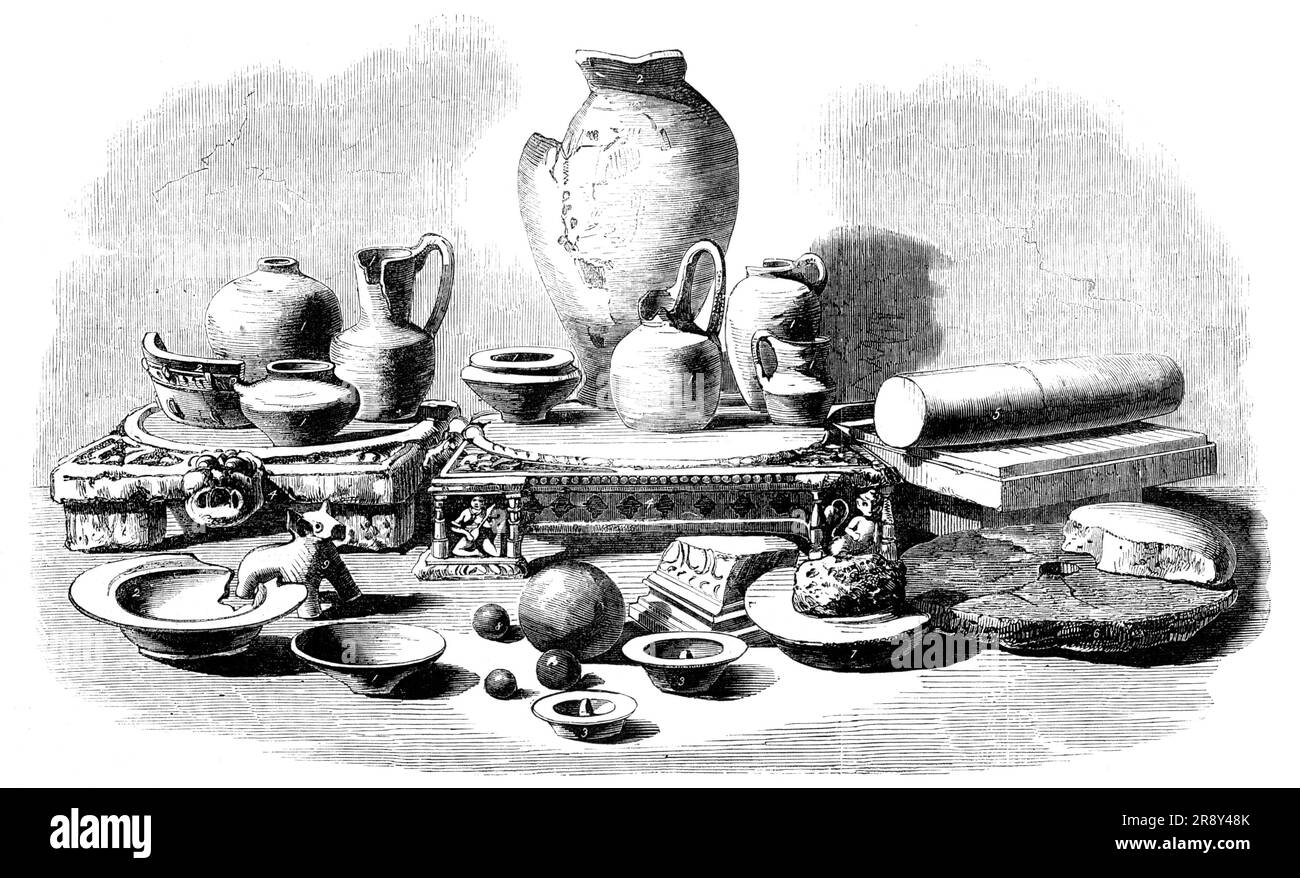 Relics from the Buried City of Brahmunabad, in Sind - Pottery, Fragments of Mills, etc, 1857. 8th- or 9th-century objects excavated at his own expense by Mr. A. F. Bellasis, of the Bombay Civil Service, in what is now Pakistan. 'Figs 1: vessels in pottery; Figs. 2: glazed pottery or earthenware, or china; Figs. 3: movable covers of water-vessels; Figs. 4: two stone short-legged tables; Fig. 5: a grinding-stone with a roller, for pulverising curry ingredients, grinding paints, &amp;c.; Figs. 6: fragments of a two-stone mill for grinding corn, and which is still in general use for that purpose t Stock Photo