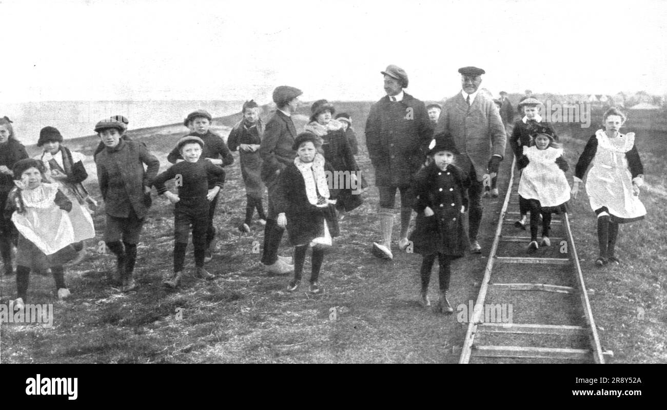 ''En Exil; L'ex-kronprinz en promenade dans l'ile de Wieringen, avec la bande d'enfants qui lui fait habituellement escorte; a sa gauche, le secretaire devenu le personnage principal de sa &quot;maison&quot;', 1918. From &quot;L'Album de la Guerre 1914-1919, Volume 2&quot; [L'Illustration, Paris, 1924]. Stock Photo