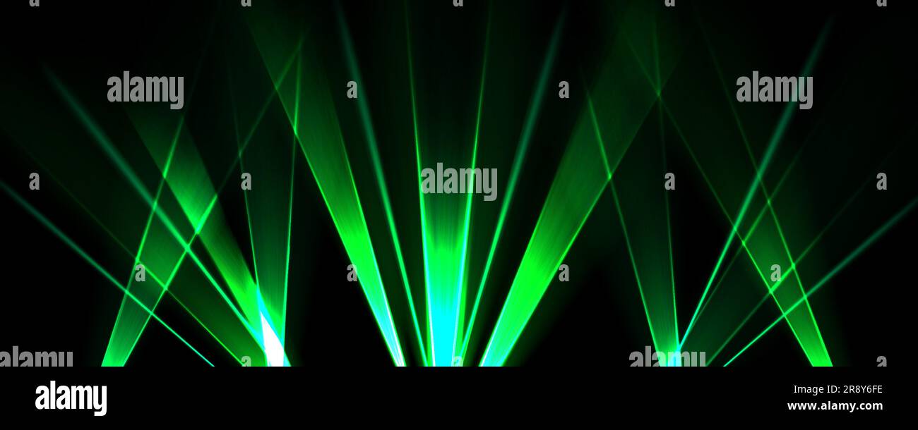 Laser show background with light beams at night. Abstract spotlight
