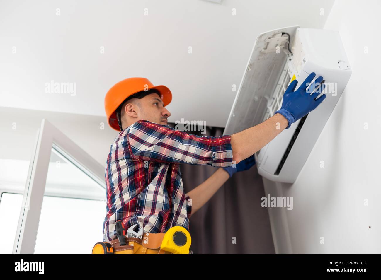 Professional technician maintaining modern air hi-res stock photography ...
