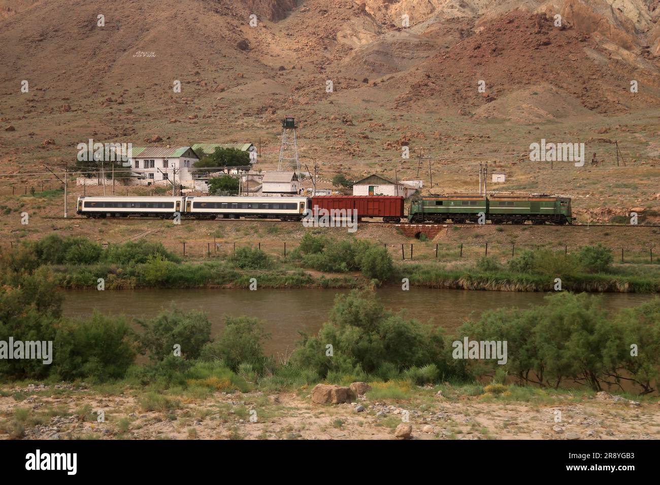 June 21, 2023, Jolfa, East Azerbaijan, Iran: A train stop at a Railway station near the Aras River at the border between northwestern Iran and Azerbaijan. The Aras (the Araks, Arax, Araxes, or Araz) is a river in the Caucasus. It rises in eastern Turkey and flows along the borders between Turkey and Armenia, between Turkey and the Nakhchivan exclave of Azerbaijan, between Iran and both Azerbaijan and Armenia, and, finally, through Azerbaijan where it flows into the Kura River. It drains the south side of the Lesser Caucasus Mountains while the Kura drains the north side of the Lesser Caucasus. Stock Photo
