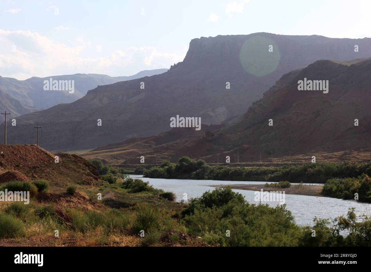 June 21, 2023, Jolfa, East Azerbaijan, Iran: A view of the Aras River at the border between northwestern Iran and Azerbaijan. The Aras (the Araks, Arax, Araxes, or Araz) is a river in the Caucasus. It rises in eastern Turkey and flows along the borders between Turkey and Armenia, between Turkey and the Nakhchivan exclave of Azerbaijan, between Iran and both Azerbaijan and Armenia, and, finally, through Azerbaijan where it flows into the Kura River. It drains the south side of the Lesser Caucasus Mountains while the Kura drains the north side of the Lesser Caucasus. The river's total length is Stock Photo