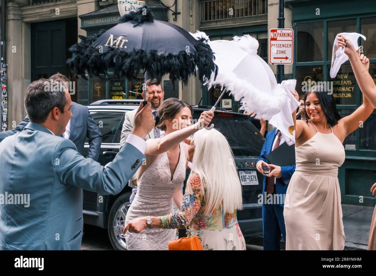 NEW ORLEANS, LA, USA - JUNE 3, 2023: Bride hugs her new mother-in-law at the end of second line parade celebrating the wedding, in the French Quarter Stock Photo