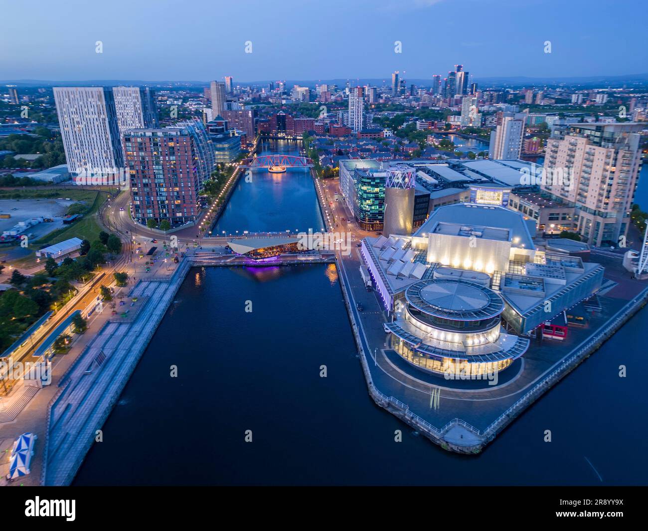 Aerial view of The Lowry Centre at Salford Quays with Manchester in background, England Stock Photo