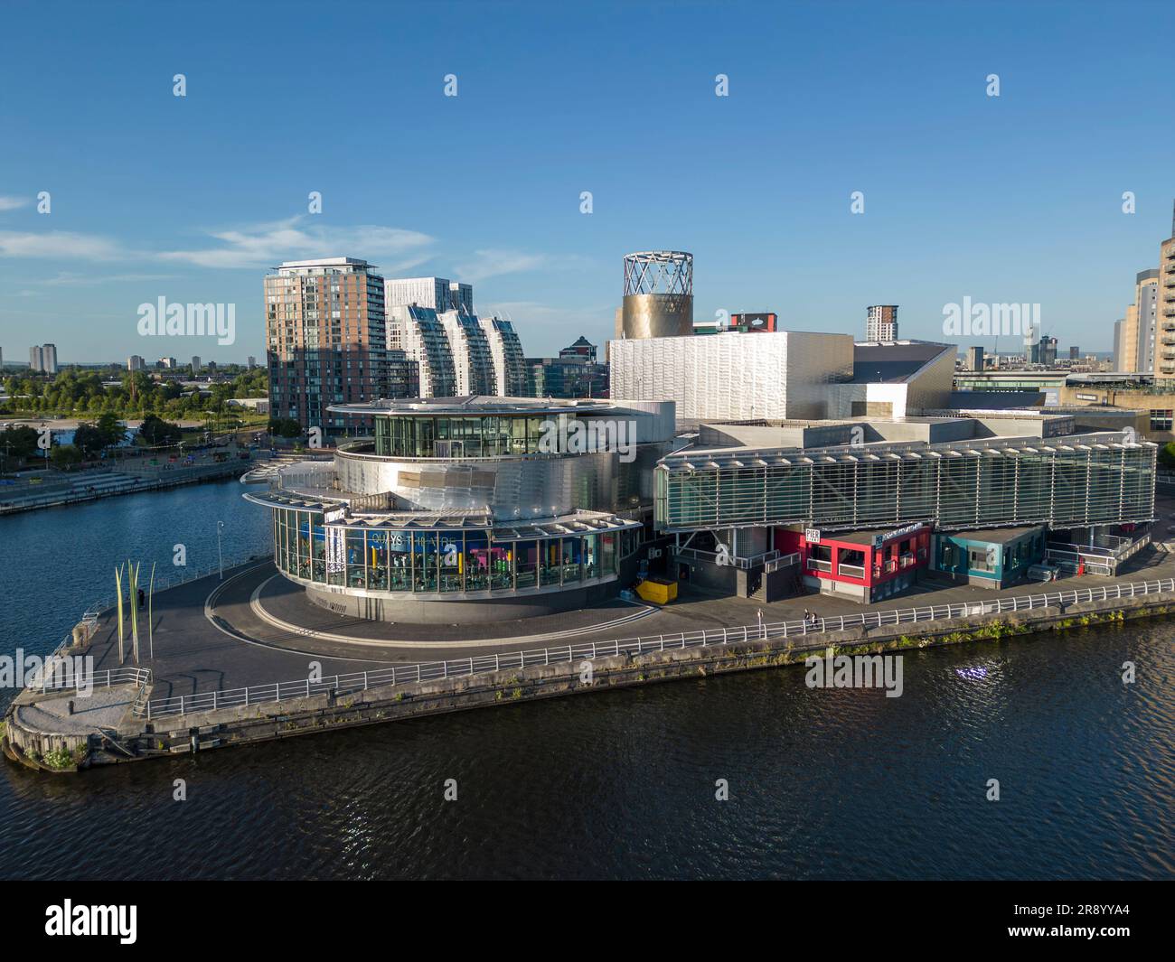 Aerial view of The Lowry Centre, Salford Quays revealing city of Manchester in background, England Stock Photo