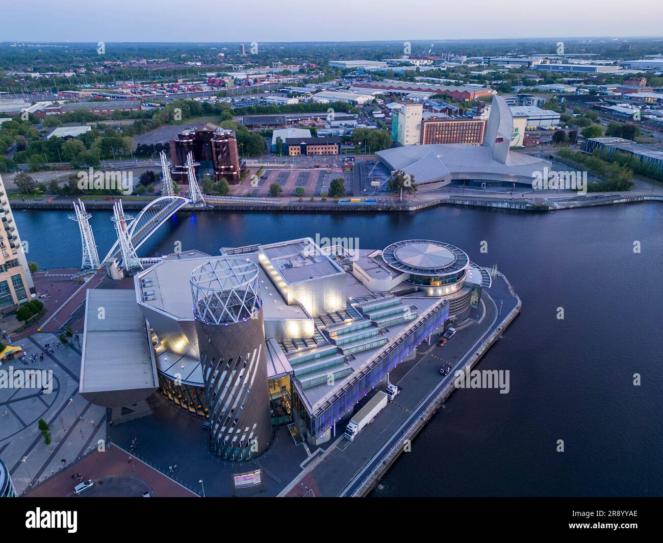 Aerial view of Lowry Centre and Imperial War Museum at dusk, Salford Quays, Manchester, England Stock Photo