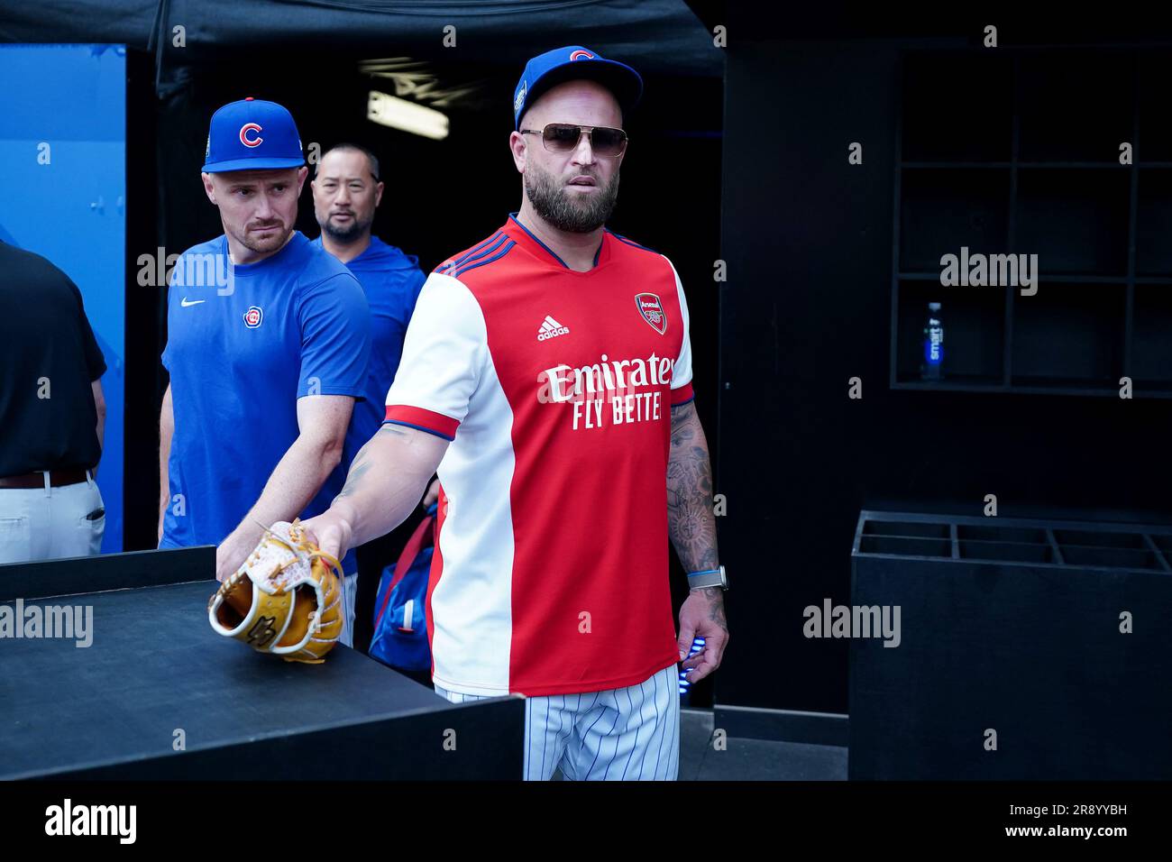 Chicago Cubs' Mike Napoli looks on while wearing an Arsenal football shirt  during a workout day ahead of the MLB London Series Match at the London  Stadium, London. Picture date: Friday June