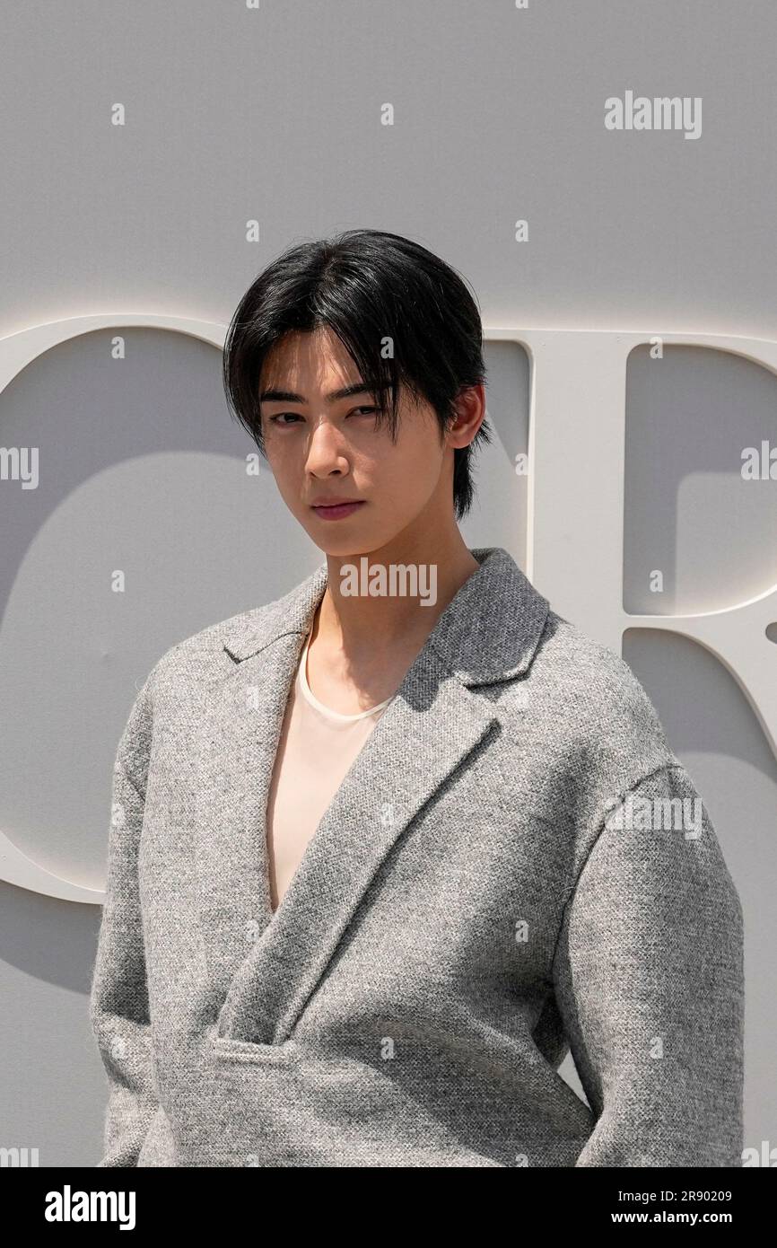 Cha Eun-woo poses for photographers upon arrival at the Dior