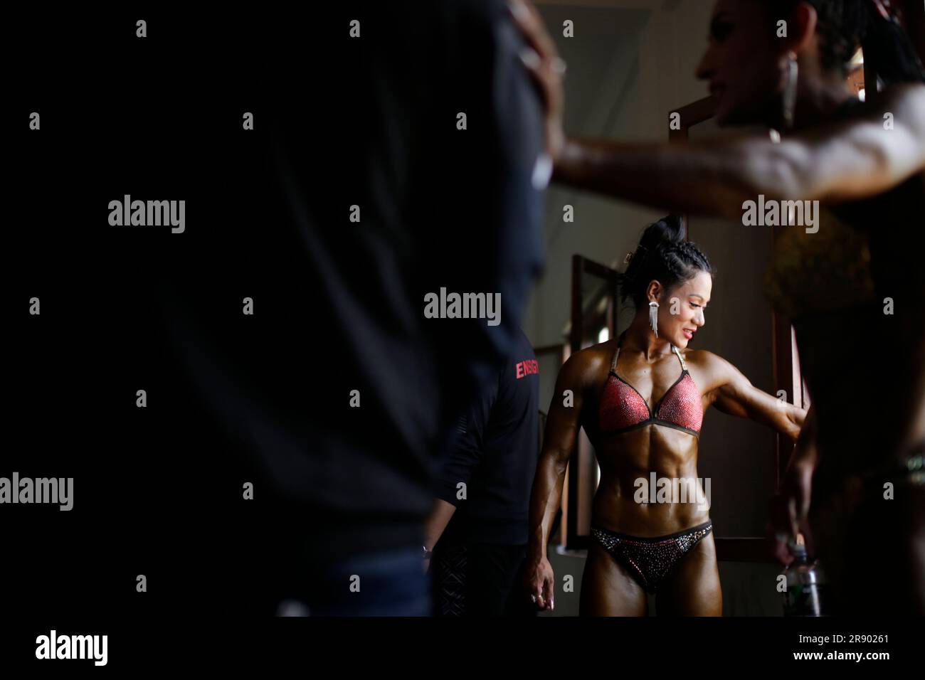 Kathmandu, Nepal. 23rd June, 2023. Female bodybuilders get ready before flexing and showcasing their physique during the national-level open bodybuilding championship held at Army Officers Club in Kathmandu, Nepal on Friday, June 23, 2023. Top competitors from all over Nepal compete for the title in different categories displaying their muscle size, symmetry, definition, and overall presentation in front of the judges and audiences. (Credit Image: © Skanda Gautam/ZUMA Press Wire) EDITORIAL USAGE ONLY! Not for Commercial USAGE! Stock Photo