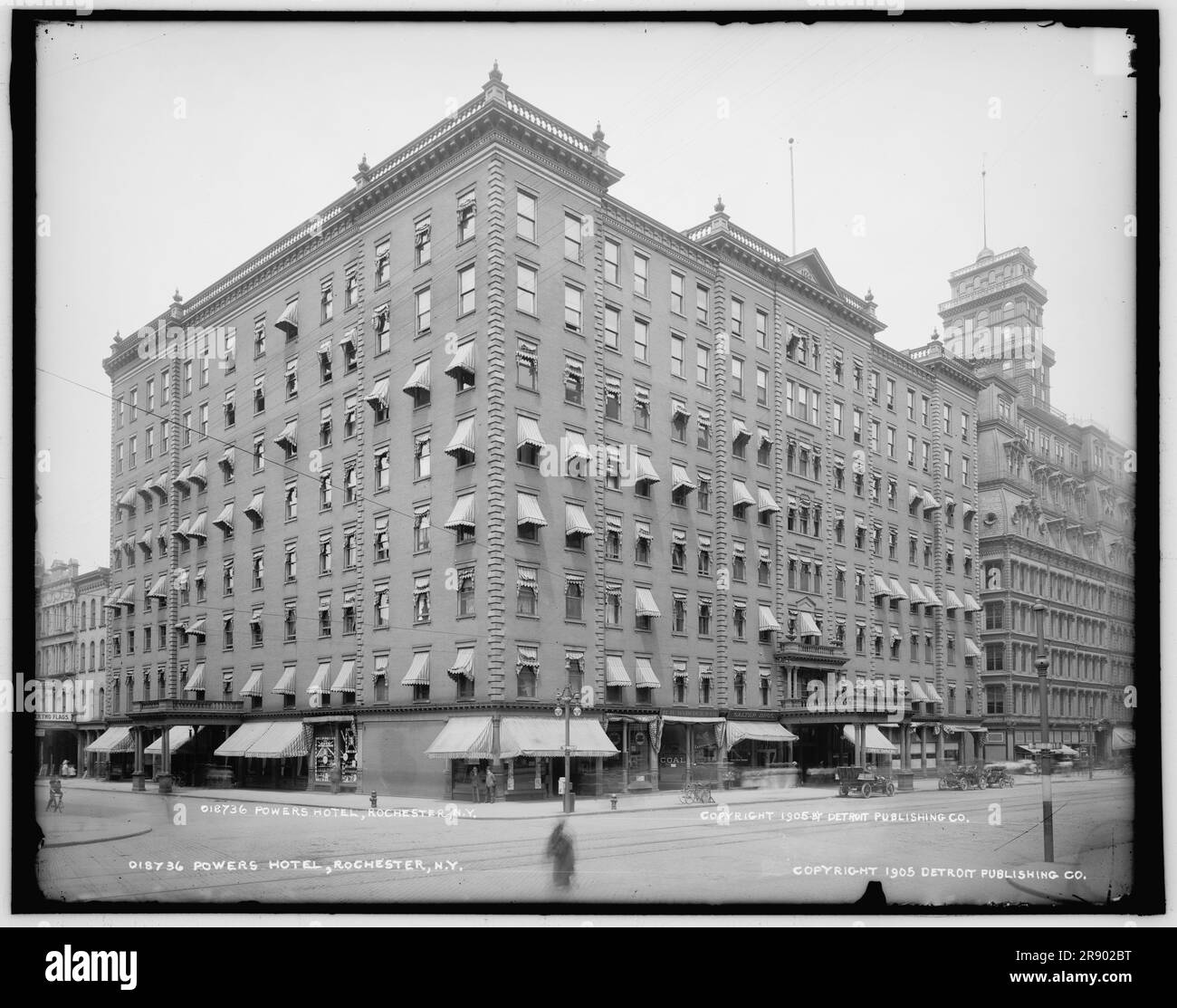 Powers Hotel, Rochester, N.Y., c1905. 'Powers Fireproof Hotel' opened in 1883. It had  four dining rooms, a banquet hall seating 500, and almost a dozen stores opening off the lobby. Famous guests who stayed at the Powers included Mark Twain, Cornelius Vanderbilt, Babe Ruth, Franklin D. Roosevelt, and Lou Gehrig. Note shops sell Remington typewriters, coal and confectionery. Stock Photo
