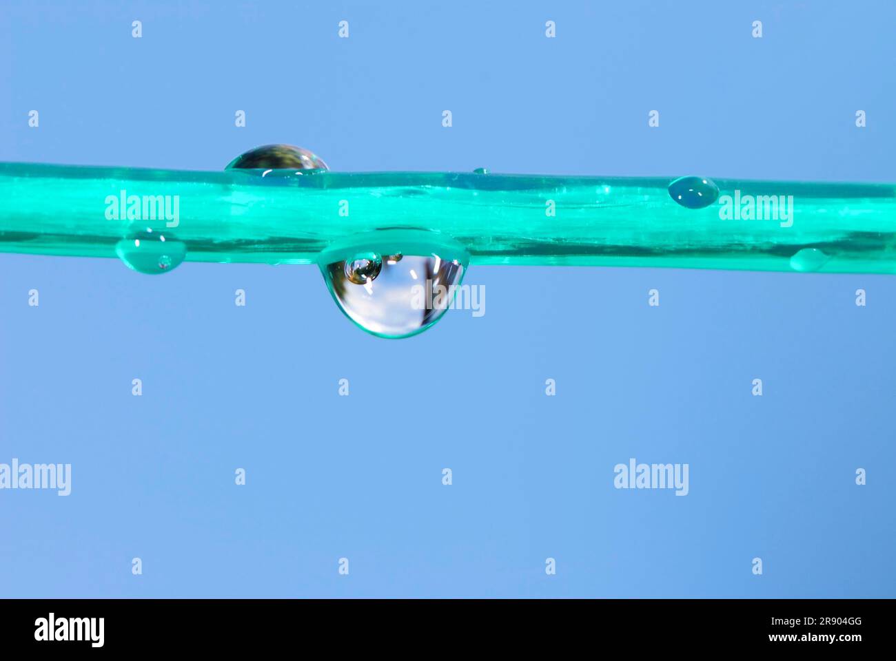 Water drops on a green cloathesline Stock Photo