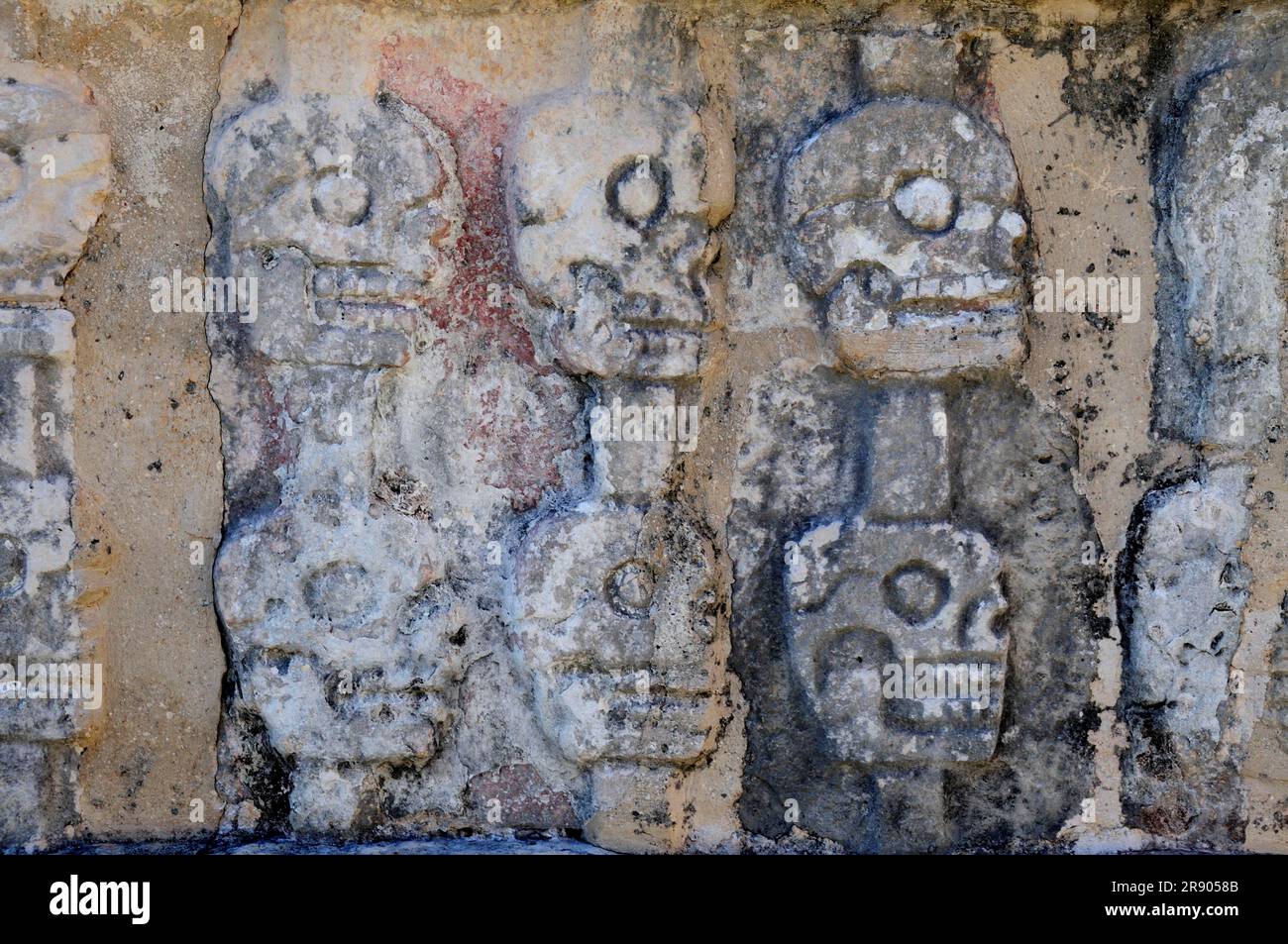 Relief of skulls, Plataforma de los Craneos Tzompantli, Chichen Itza, Mexico Stock Photo