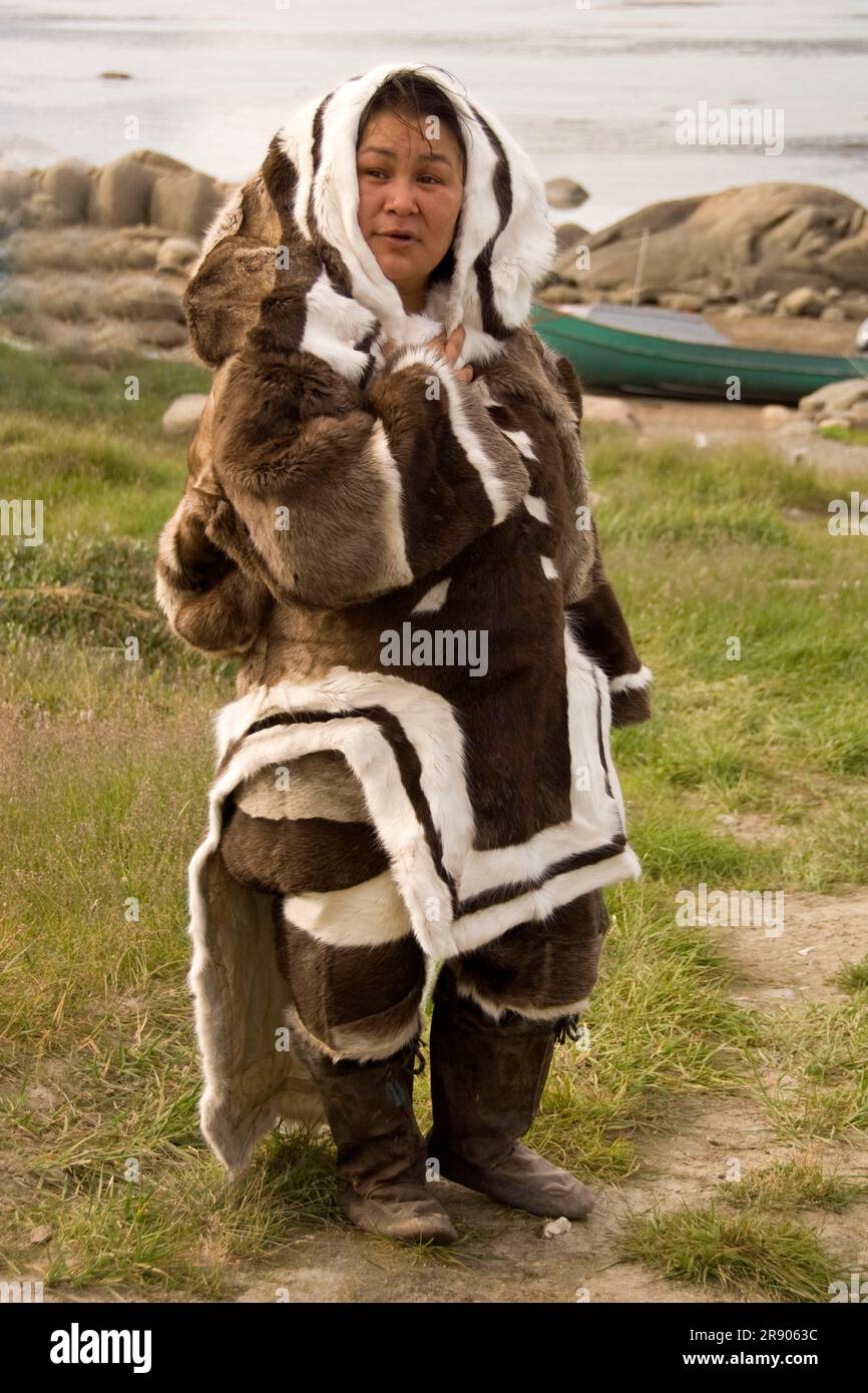 Inuit woman, in traditional seal skin clothing, Pangnirtung, Baffin ...
