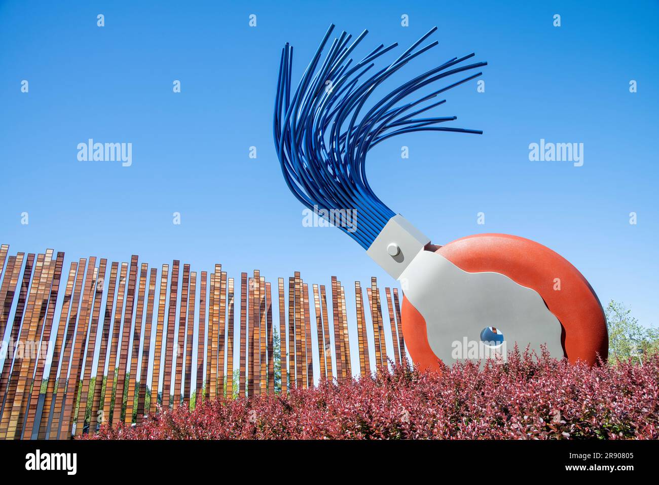 Seattle, WA, USA-July 2022; Low angle view sculpture Scale X: Typewriter Eraser, by Oldenburg and Van Bruggen and artwork Grass Blades by John Fleming Stock Photo