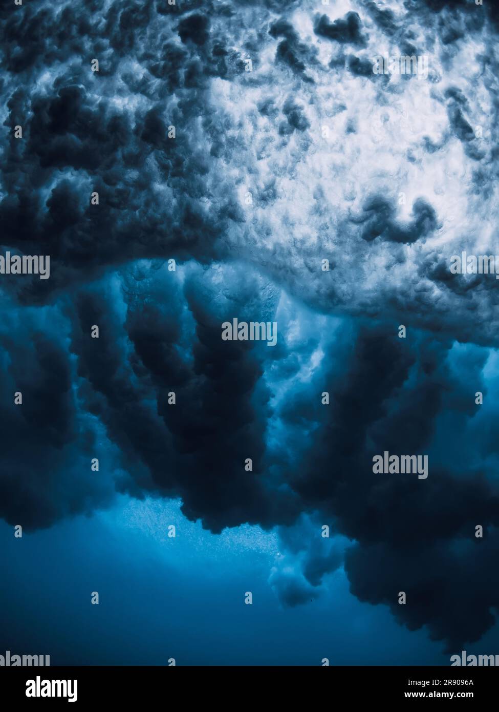 Ocean wave texture with foam, vortex underwater in transparent sea water. Stock Photo