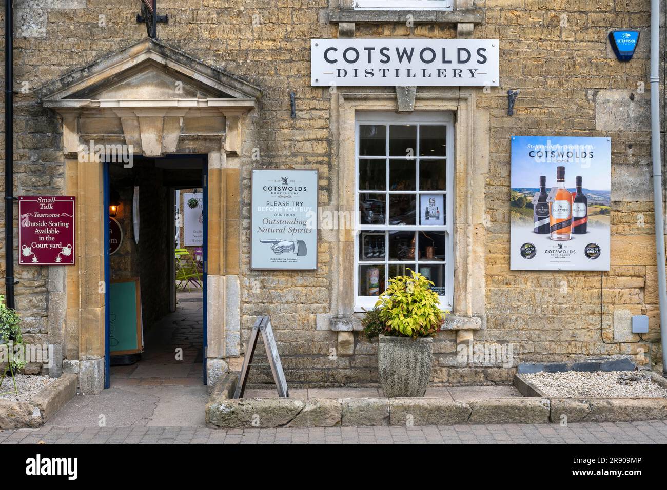 Old stone house in detail with sales shop of the Cotswolds Distillery