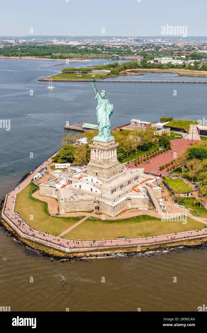 Statue of Liberty on Ellis Island, New York City, New York. Color daytime  landscape photo, statue is in center of frame, ample copy space in sky  Stock Photo - Alamy