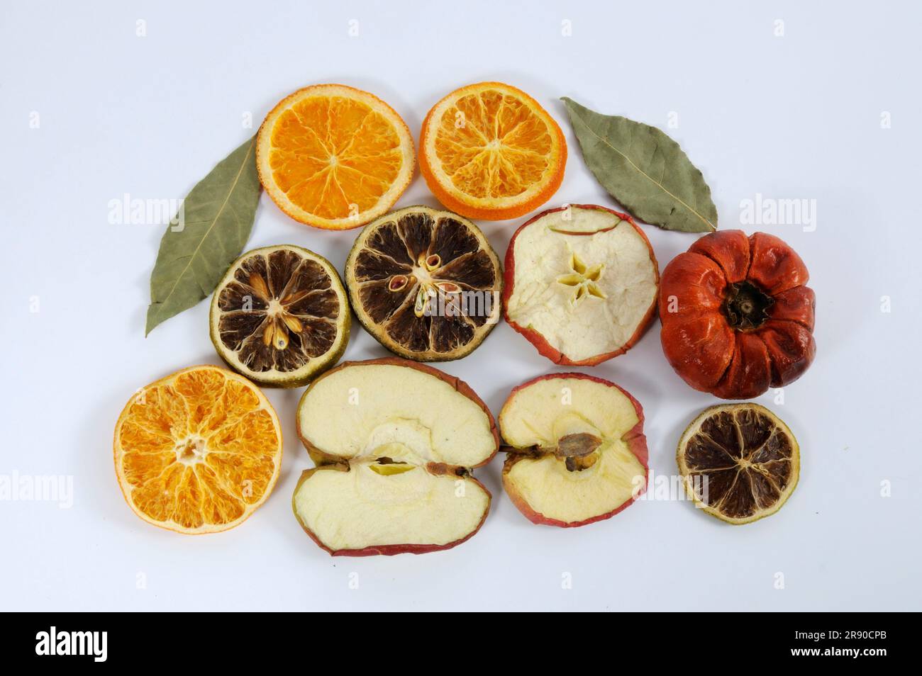 Dried fruits for decoration, apple, orange, bay leaf, lime, fruit potpourri, decorative fruits Stock Photo