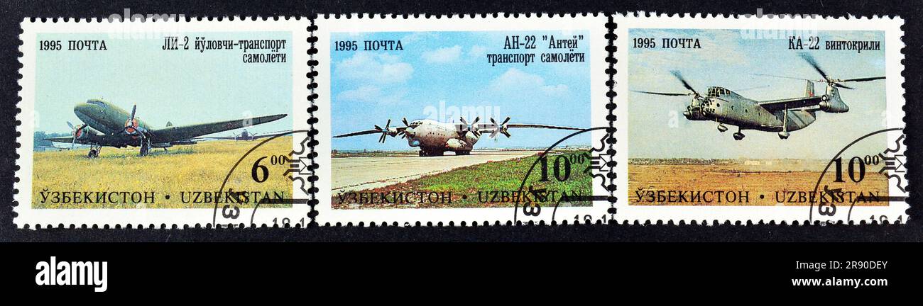 Cancelled postage stamps printed by Uzbekistan, that show Aircraft of Tashkent's (V.P. Chkalov) Aircraft Factory, circa 1995. Stock Photo