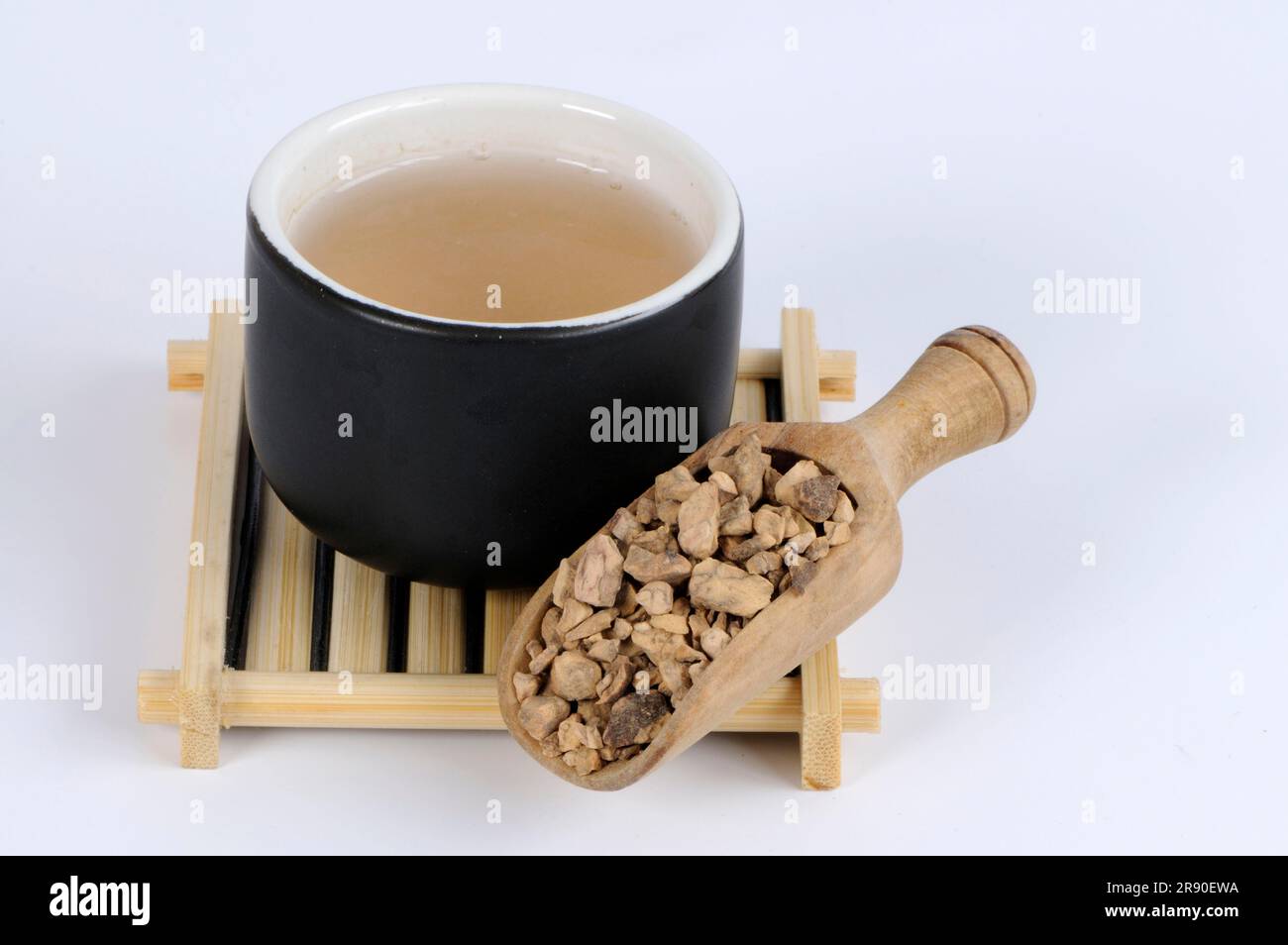Polygonum root tea (Polygoni multiflori Radix) in cup, Polygonum root, Knotweed root tea Stock Photo