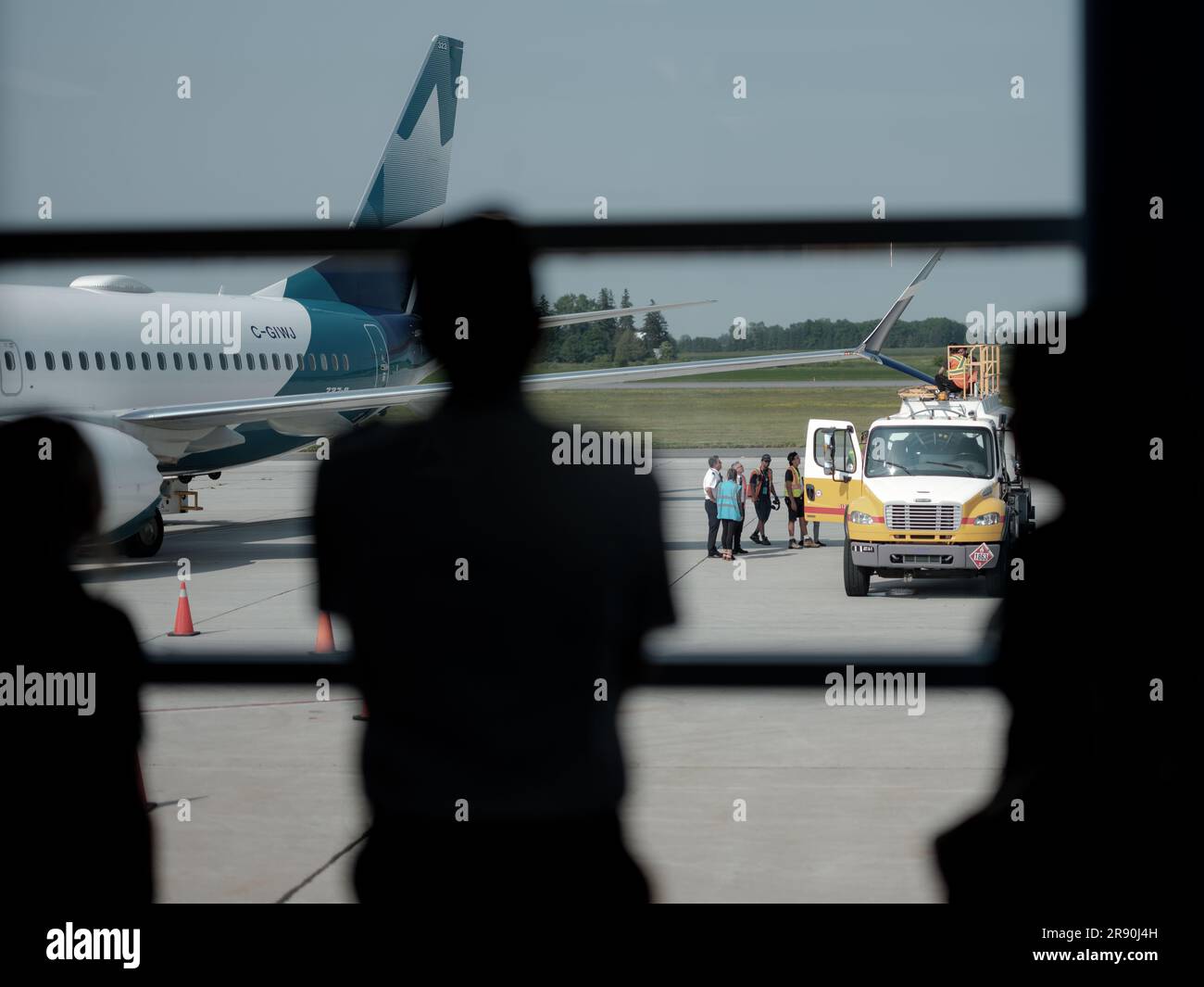 Westjet airplanes on the service ramp at Calgary Airport in Alberta, Canada. Stock Photo