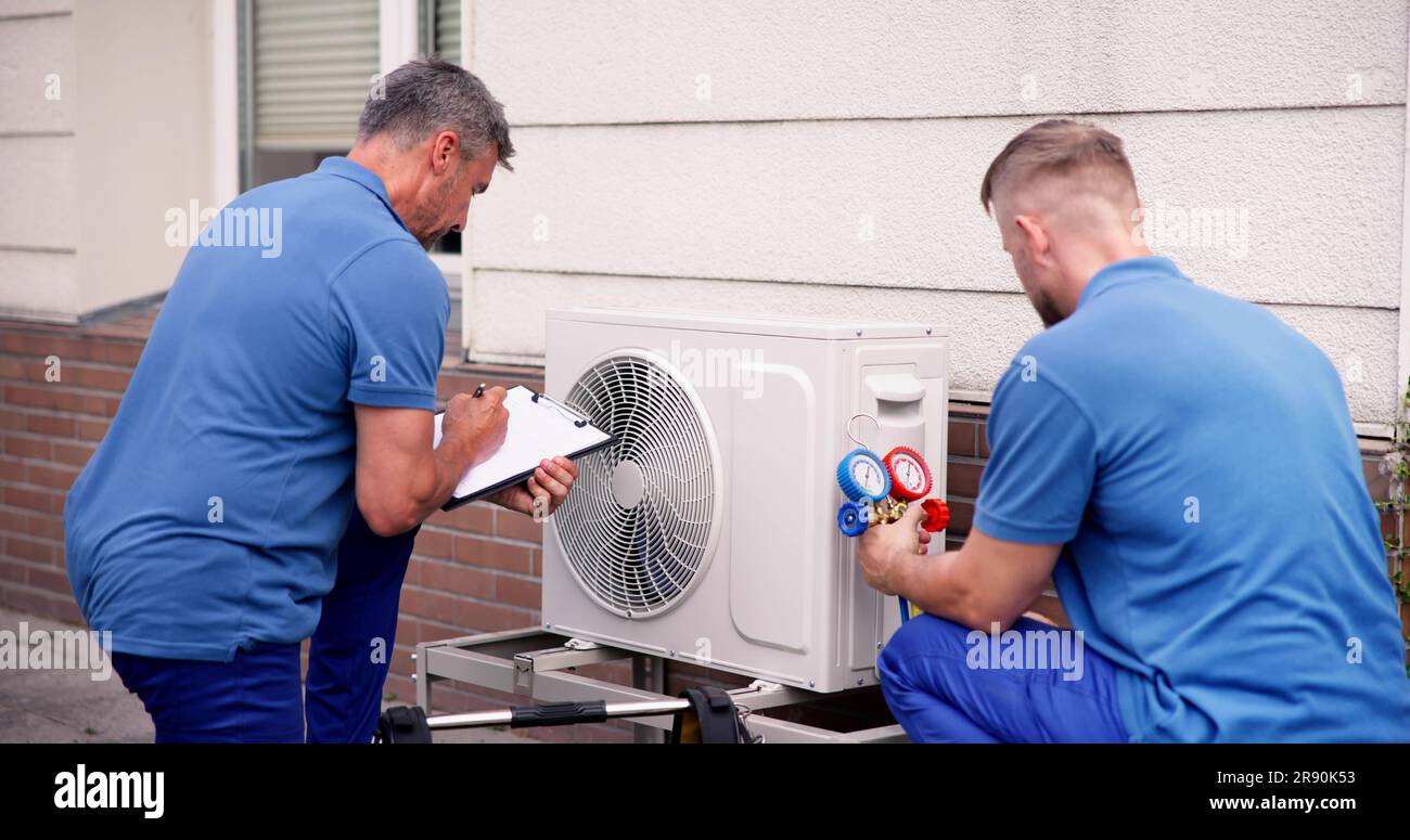Industrial Air Conditioning Technician. HVAC Cooling System Repair Stock Photo
