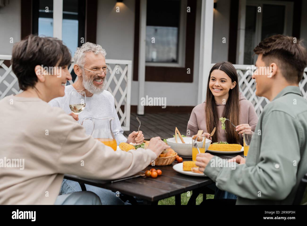 family bbq party, celebration of parents day, cheerful teenage girl