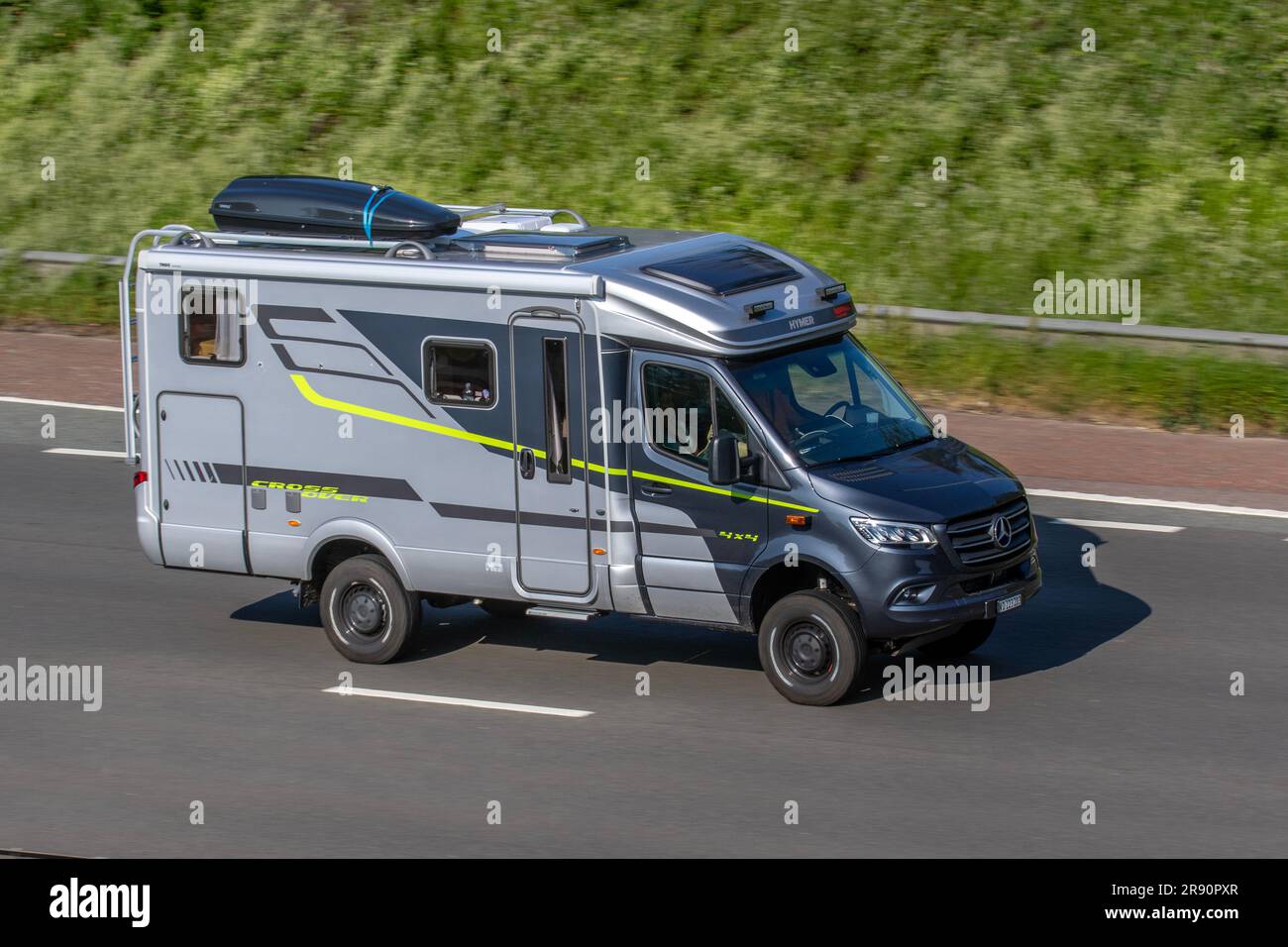 Mercedes Benz HYMER ML-T CrossOver 4x4 off-road motorhome; travelling on the M6 motorway in Greater Manchester, UK Stock Photo