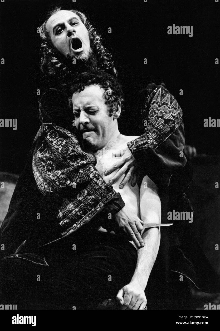 Emrys James (Shylock - rear), Tony Church (Antonio) in THE MERCHANT OF VENICE by Shakespeare at the Royal Shakespeare Company (RSC), Royal Shakespeare Theatre, Stratford-upon-Avon, England  30/03/1971  set design: Timothy O'Brien  costumes: Tazeena Firth & Timothy O'Brien  lighting: John Bradley  director: Terry Hands Stock Photo