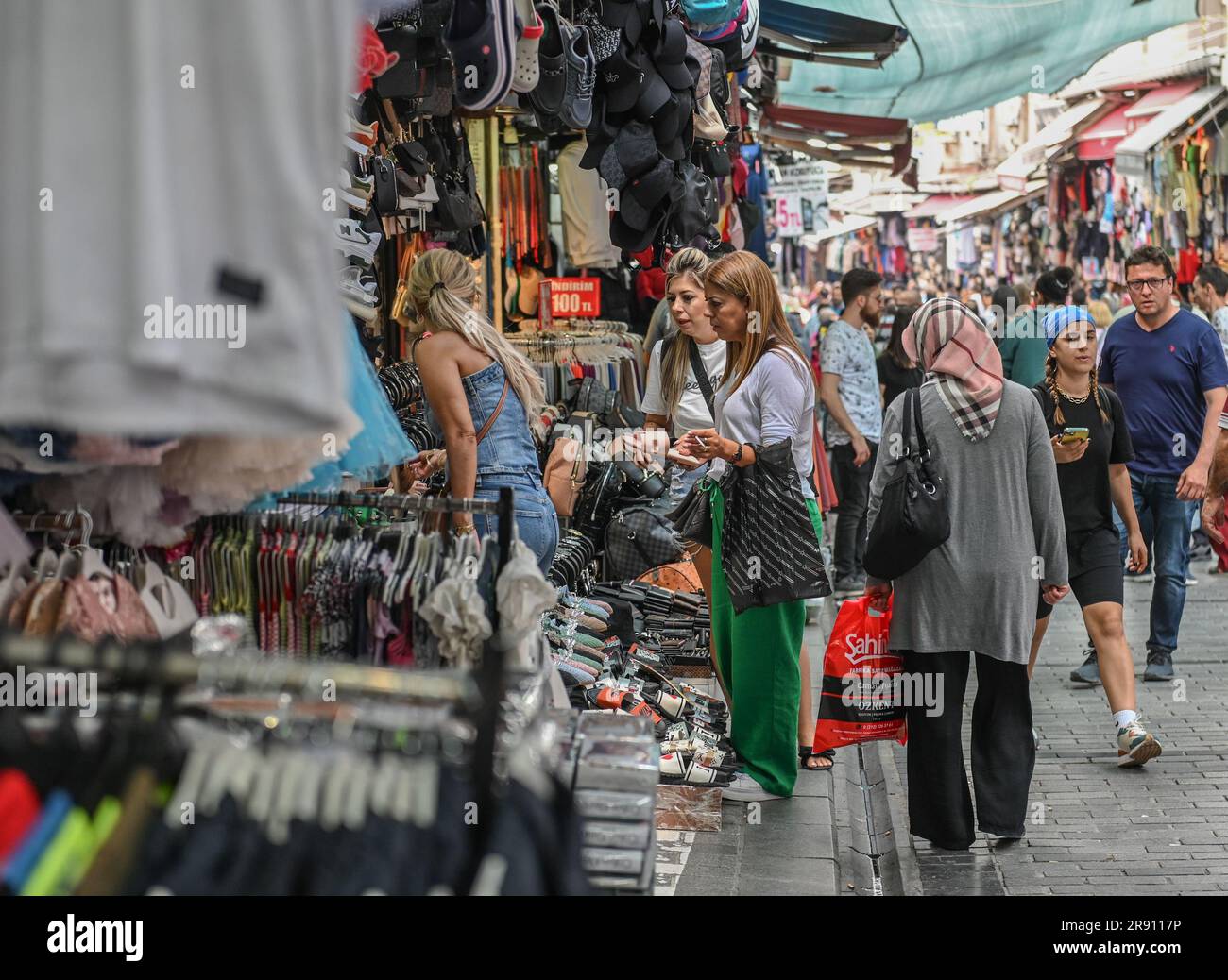 Istanbul, T¨¹rkiye. 19th June, 2023. Customers select goods in a small shop at the Mahmutpasa neighborhood in Istanbul, T¨¹rkiye, June 19, 2023. TO GO WITH 'Feature: Turks' Eid celebration squeezed by limited budget due to high inflation' Credit: Omer Kuscu/Xinhua/Alamy Live News Stock Photo