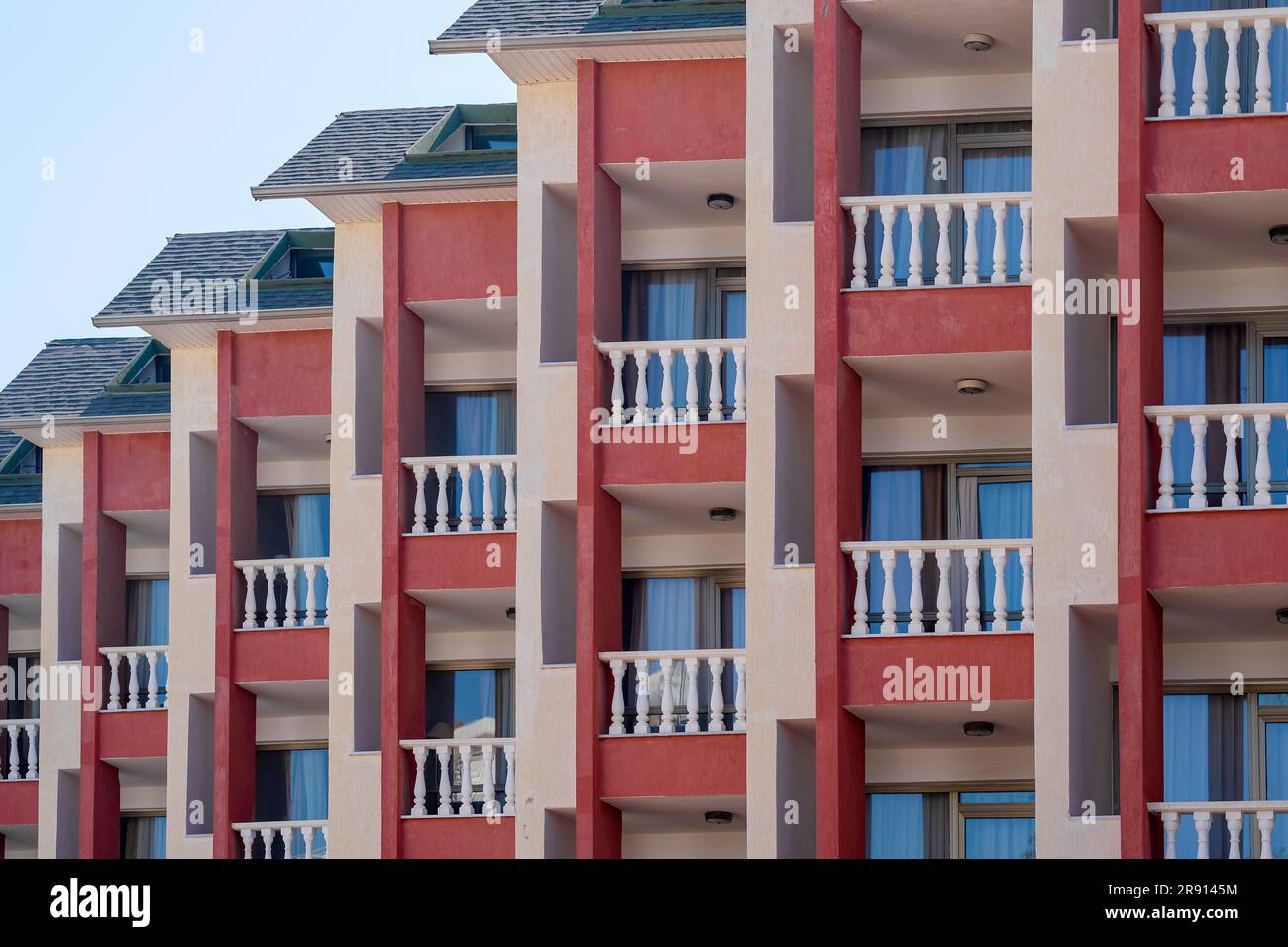 city geometry. A row of small identical balconies with white railings ...
