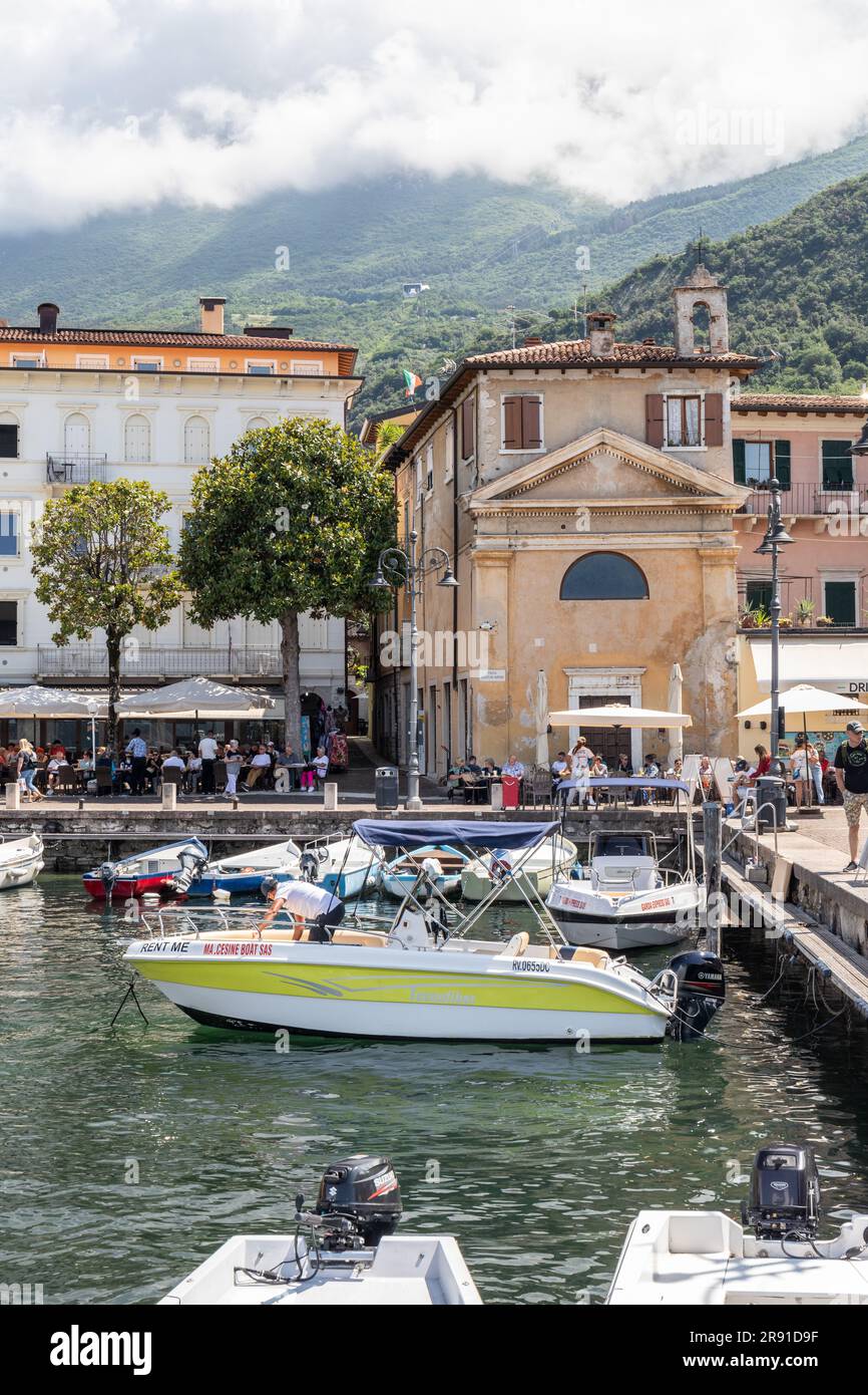 The picturesque port Malcesine in Piazza Guglielmo Marconi which is surrounded by many restaurants and cafes, Malcesine, Lake Garda, Italy, Europe Stock Photo