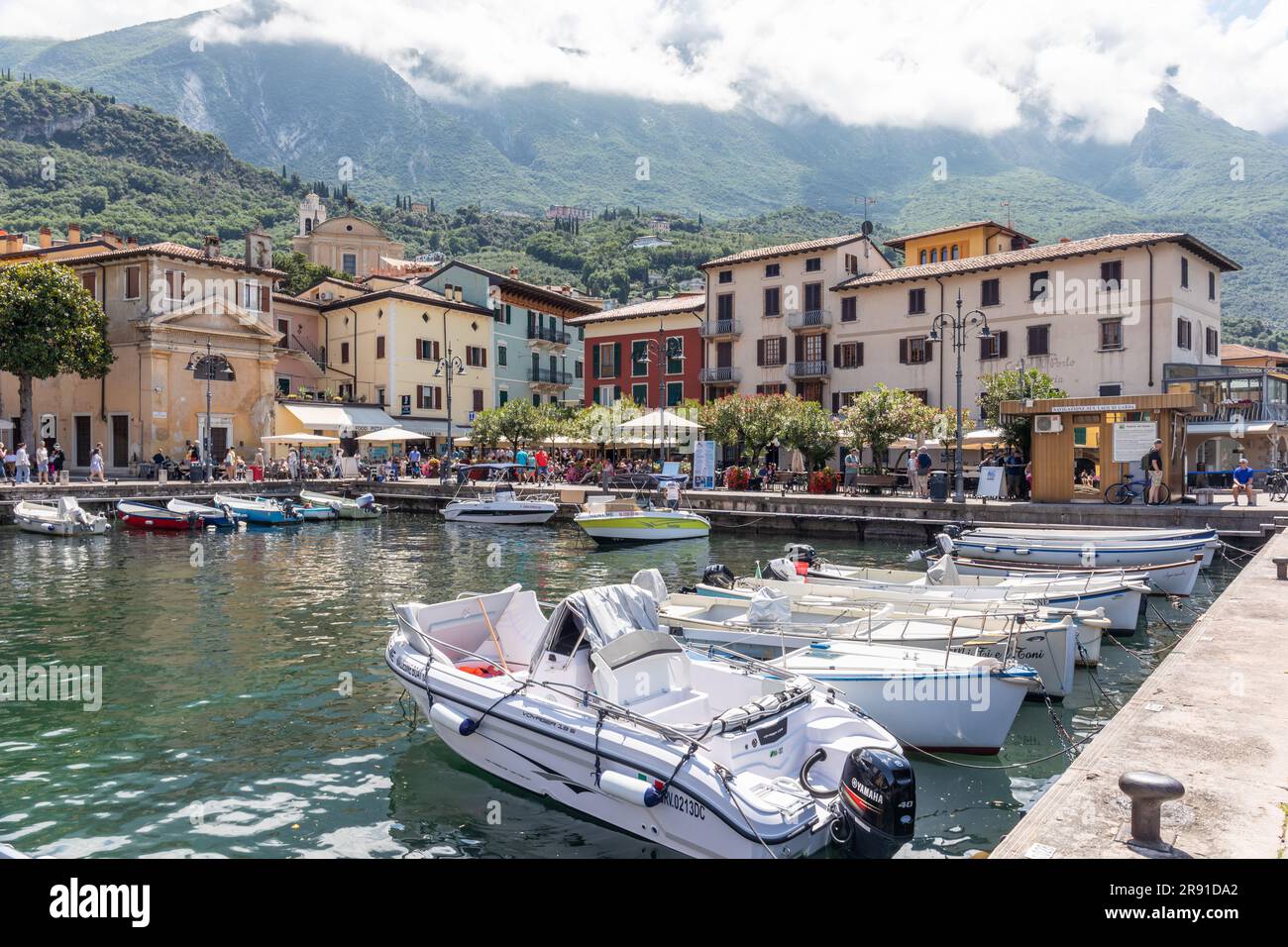 The picturesque port Malcesine in Piazza Guglielmo Marconi which is surrounded by many restaurants and cafes, Malcesine, Lake Garda, Italy, Europe Stock Photo