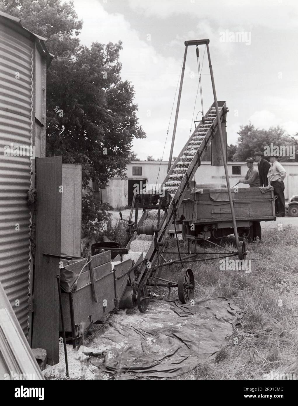 Illinois:  June, 1941 A USDA representative supervises the removal of corn from the bins of the Ever Normal Granary near Chicago, which was taken over by the Department of Agriculture when loans to farmers secured by the corn fell due. Stock Photo