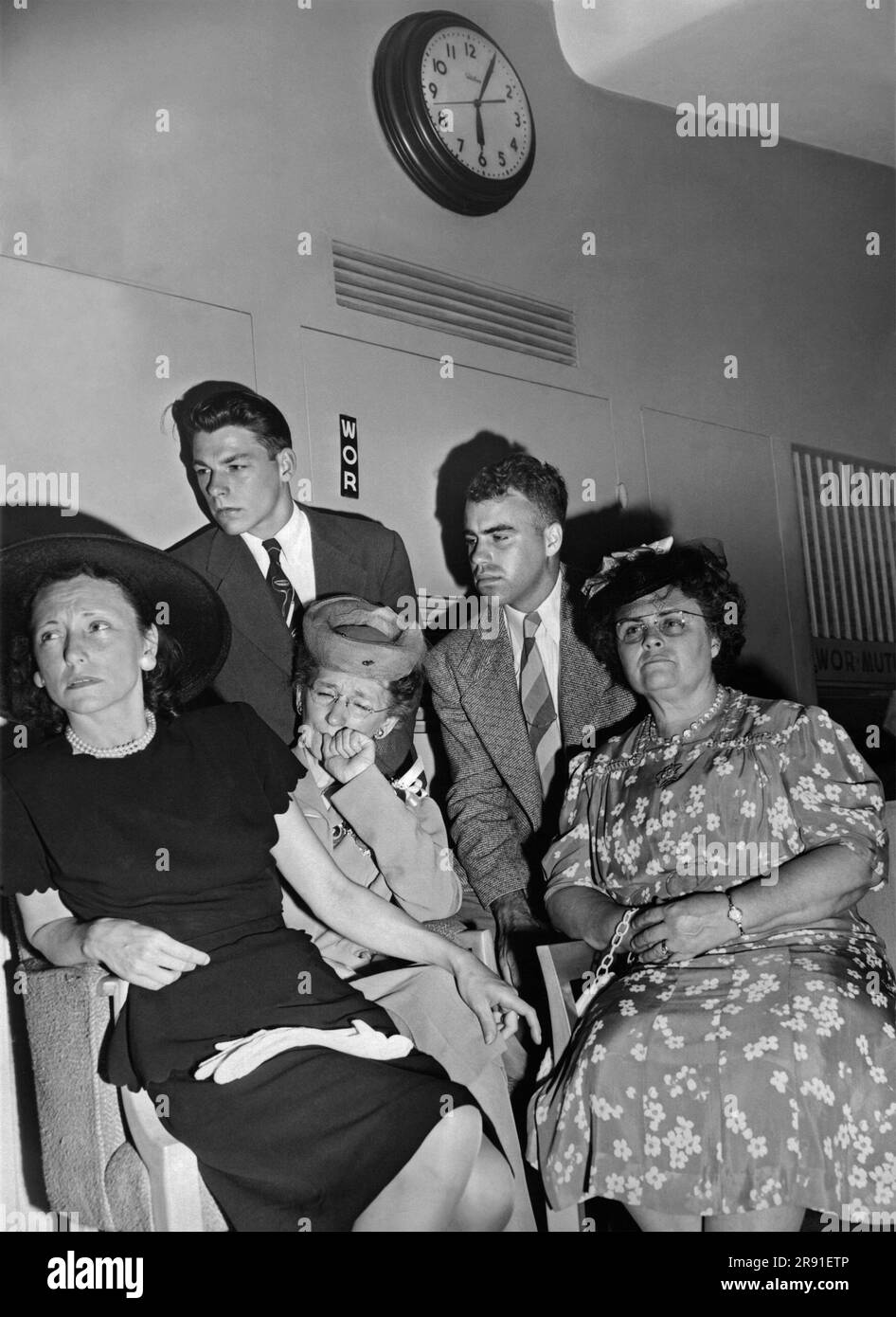 New York City, New York  July 1, 1946 The relatives of members of the crew of Dave's Dream hearing the broadcast on WOR radio station of the B-29 as it dropped an atomic bomb on Bikini Atoll. Stock Photo