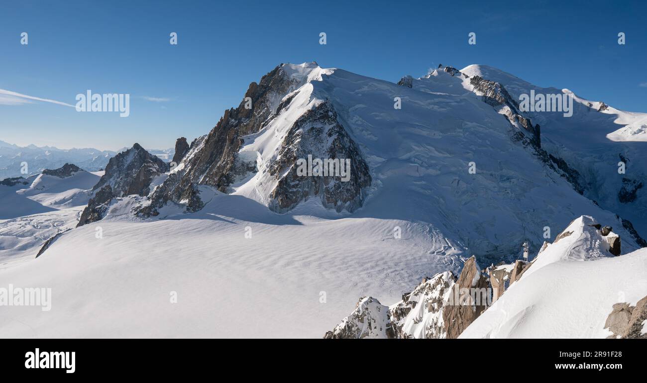 An aerial view of the beautiful snowy jagged Aiguille du Midi mountains ...
