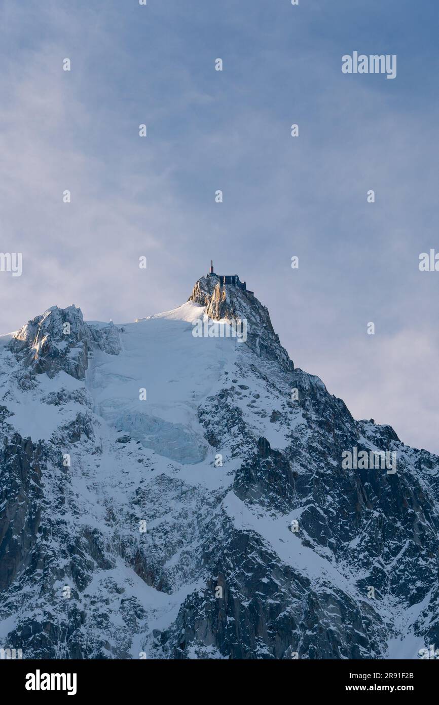An aerial view of the beautiful snowy jagged Aiguille du Midi mountains ...