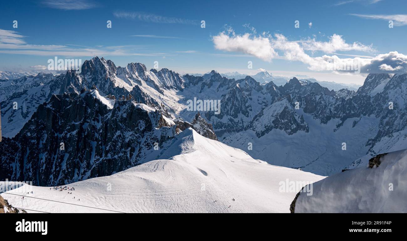 An aerial view of the beautiful snowy jagged Aiguille du Midi mountains ...