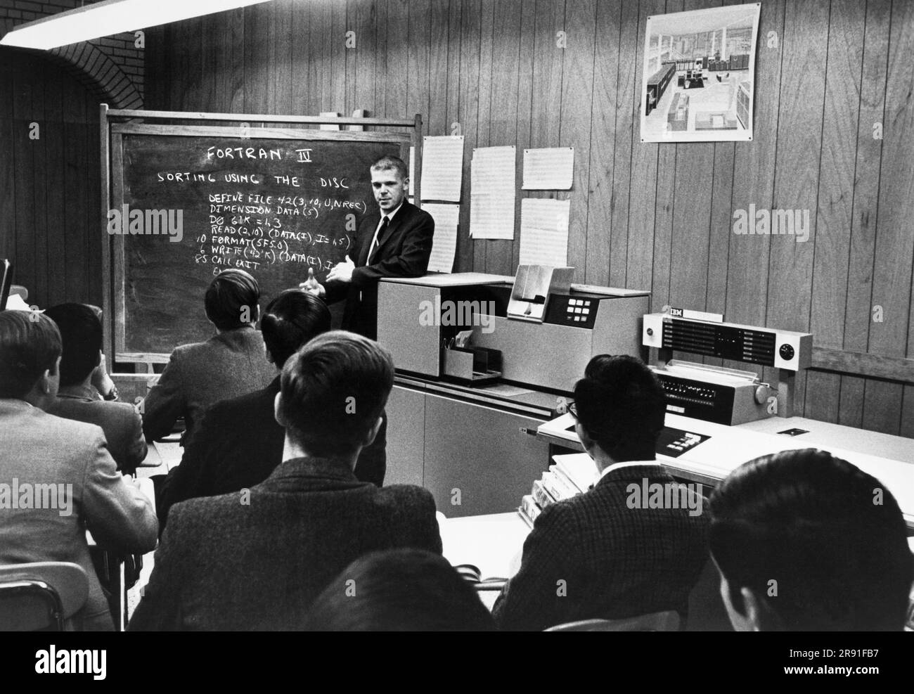 Boston, Massachusetts:  October 4, 1968 An instructor at the Boston Latin School is using an IBM 1130 computer to teach the FORTRAN computer language and programming to students. Stock Photo
