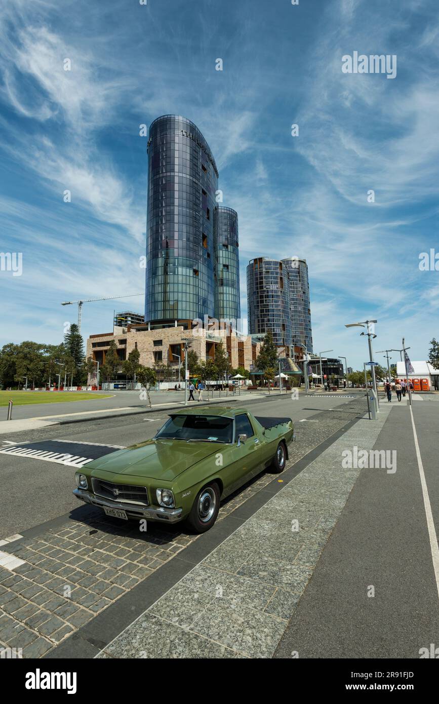 A typical old retro Australian ute vehicle parked in front of modern architecture in Perth City in Western Australia Stock Photo