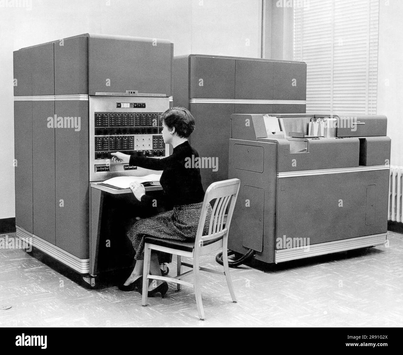 New York:  1954. IBM 650 Data Processing System, the first mass produced computer. IBM sold 450 of them the first year. Acessories include up to 4 disk units, each holding 6 Mb of data.. Stock Photo