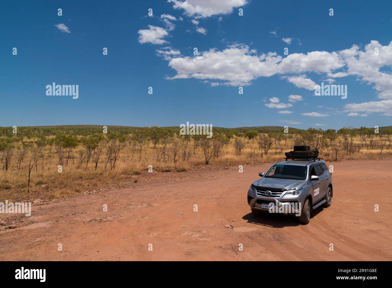 A 4x4 hire car stopped at a rest area on the dirt track near the end of the Gibb River Road in Western Australia Stock Photo