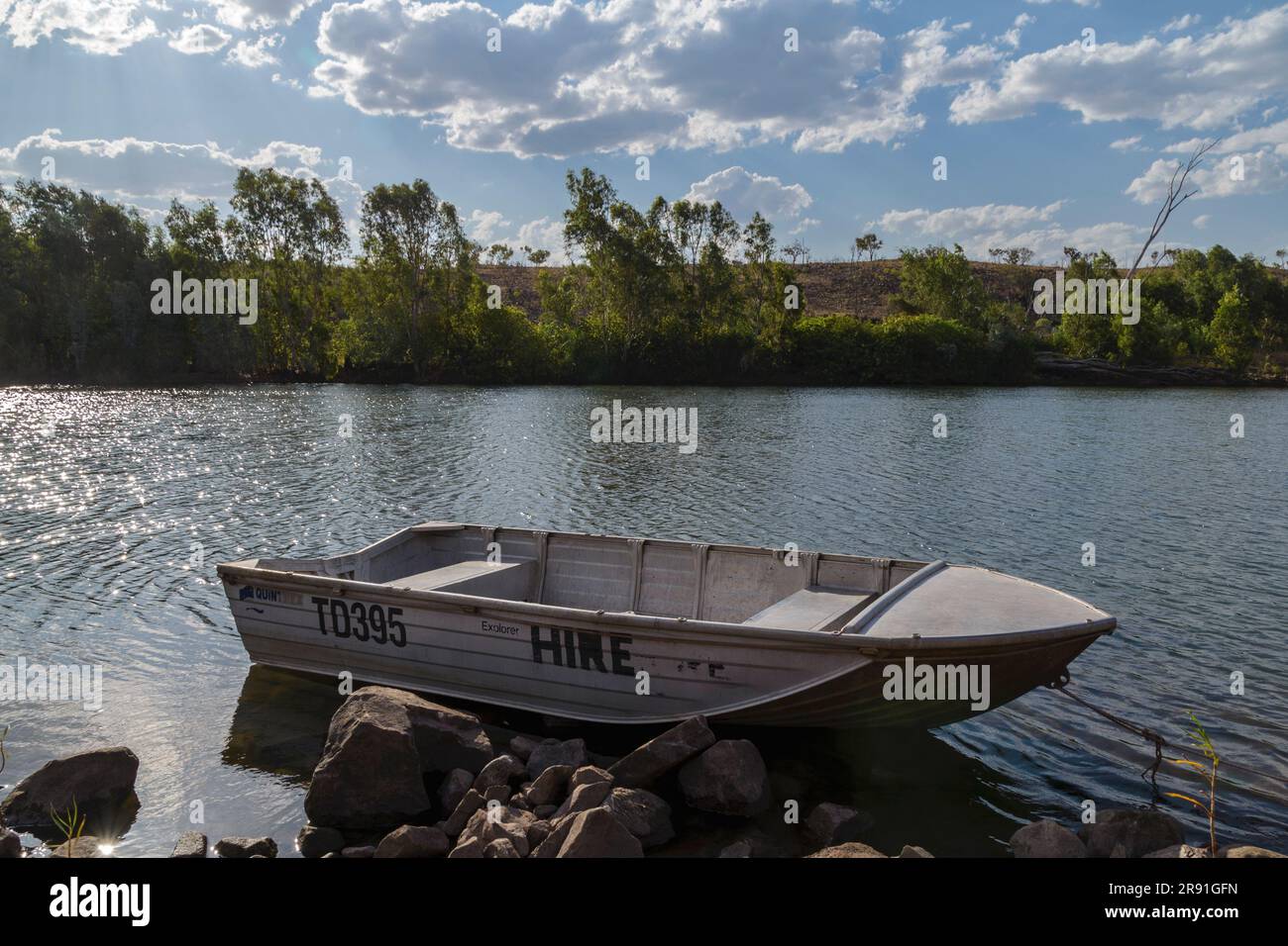 A small tin boat is moored at the side of the Chamberlain River in Western Australia Stock Photo