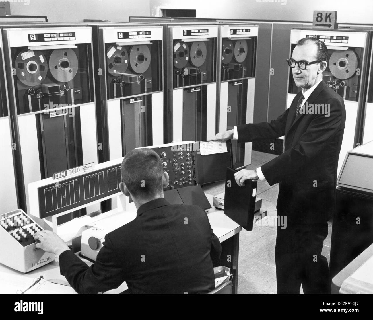 Pontiac, Michigan:  c. 1962 Engineers at the GMC Truck Division use an IBM digital computer in place of field tests to evaluate braking systems. Stock Photo