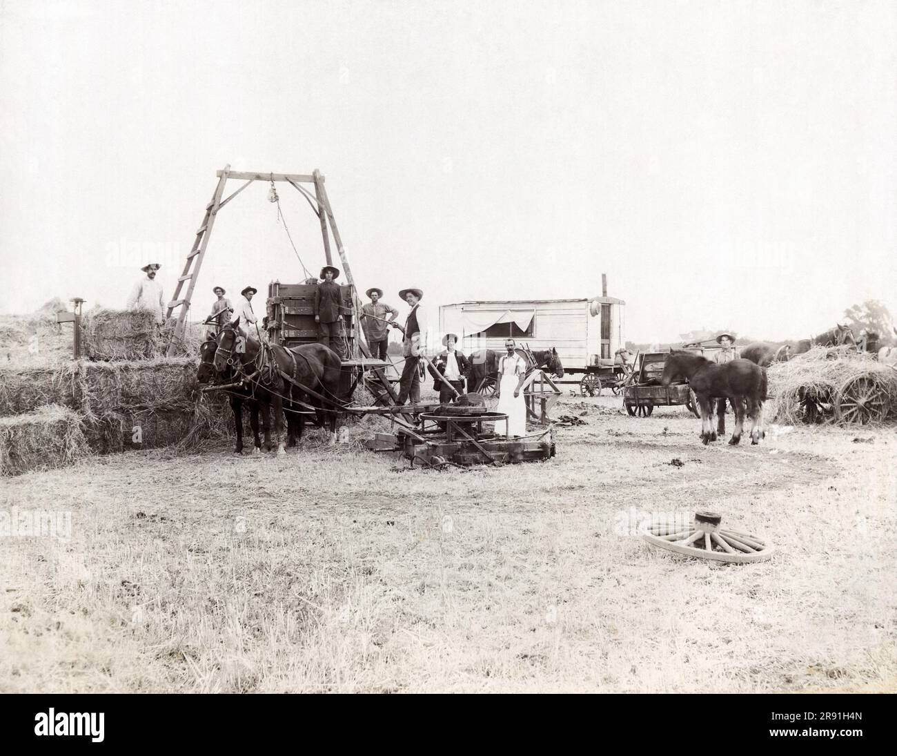 United States c. 1890 A farmer and his workers using a horse powered