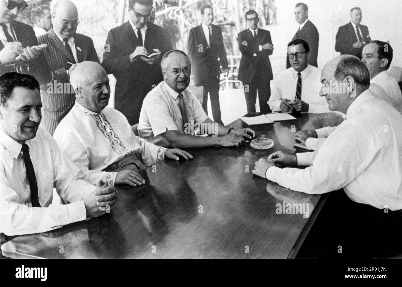 Gagra, USSR:  August 9, 1963 Smiles and shirtsleevs abound at  Soviet Premier Nikita Krushchev's summer residence in Gagra after the signing of the limited nuclear test ban pact. U.S. Secretary of State Dean Rusk, who signed the treaty for the U.S. is at the right and facing him across the table from left to right is Soviet Foreign Minister Andrei Gromyko, Krushchev and Anatoly Dobrynin, Soviet ambassador to the U.S. Stock Photo